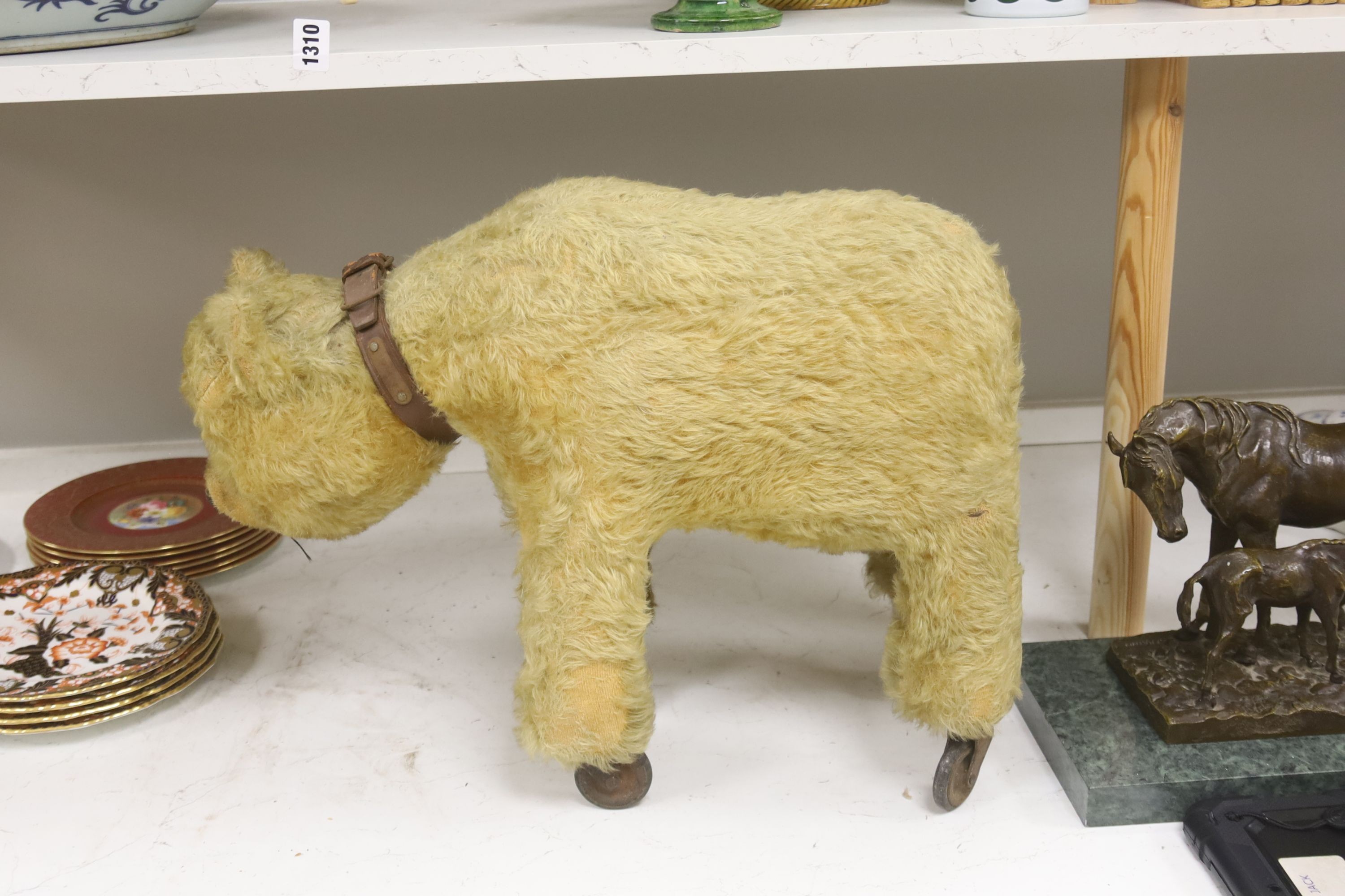 A blonde plush bear on wheels (put on later) 55cm